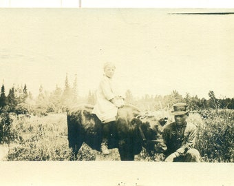 African American Teen Boy Holding Calf For White Girl To Ride Sit On Farm Hand AZO Antique RPPC Real Photo Postcard