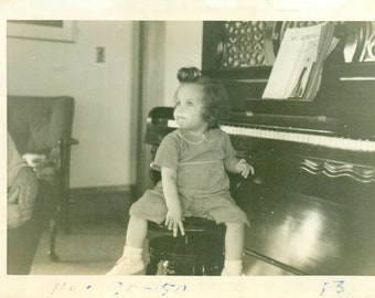 1950 Toddler Girl With Big Curl Sitting at Piano Vintage Black White Photo Photograph