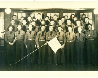 WW2 Era Army Soldiers Holding Best Barrack Flag 1940s RPPC Real Photo Postcard Photograph