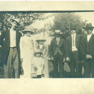 Family In Hats Girl Holding Purse Mom Dad Old Man 1910s RPPC Real Photo Postcard Photograph
