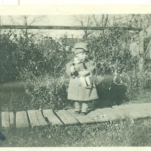 1920s Toddler Girl Holding Baby Doll Button Boots Coat Hat 20s Vintage Photograph Black White Photo