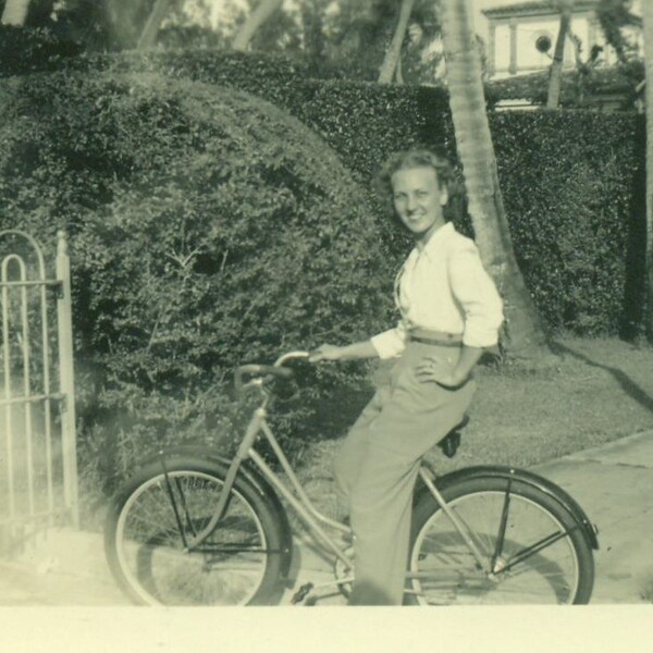 WW2 Era Woman Riding Bicycle High Waisted Pants Bike 1940s Lady World War 2 Vintage Black And White  Photo Photograph