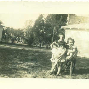 1930s A Jumble of Girls and Dolls in a Chair Outside 30s Vintage Photograph Black White Photo
