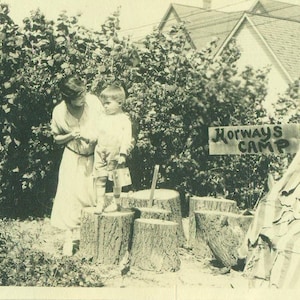 1920s Korways Camp Little Boy Standing on Firewood Log Mom Grandpa 20s Antique Vintage Photograph Black White Photo