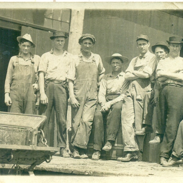 Work Men Holding Clipboard Denim Overalls Standing Outside Barrels 1920s RPPC Real Photo Postcard