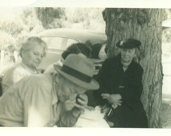 Old Man Getting Tired Ready for a Nap Wife Dressed in Black Outside Summer Picnic  Vintage Black and White Photo Photograph