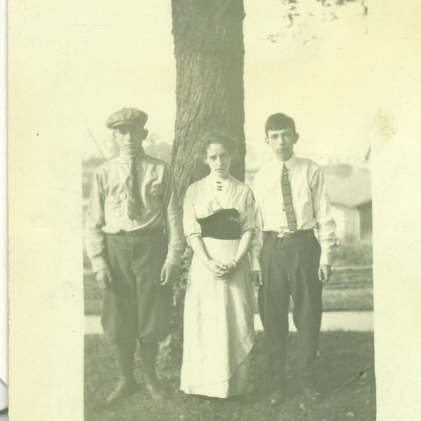 Center Sister Tired of Brothers Shenanigans Teen Boys Girl 1900s RPPC Real Photo Postcard Photograph Photo