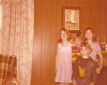 1979 Blonde Kids Standing in Wood Panel Living Room Trophies On Mantel 70s Vintage Photograph Color Photo