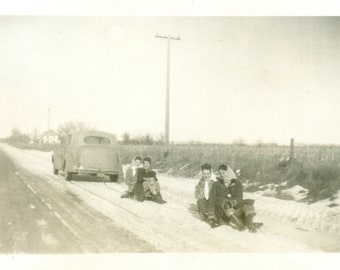 1948 Radio Flyer Sleds Being Towed By A Car Midwestern Farm Winter Vintage Black White Photo Photograph