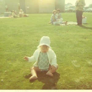 1972 Baby Unsure of Grass She is Sitting on in the Park 70s Vintage Photograph Color Photo