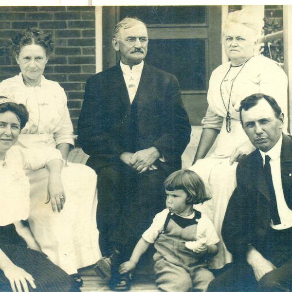 Mouth Full of Bread Girl Holding Bagel Playing with Grandfathers Shoe Vintage RPPC Real Photo Postcard unmailed