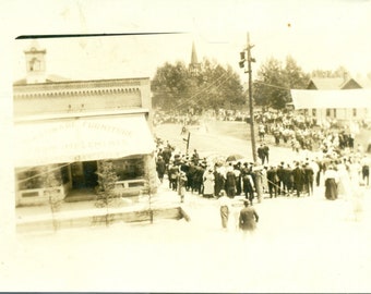 Early 1900s Crowd in Street Watching Hose Demonstration Next To Store RPPC Real Photo Postcard Antique