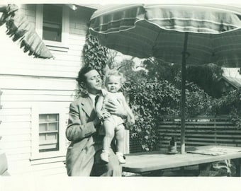 Father And Daughter 1940s Curly Hair Blonde Held Outside 40s Vintage Black and White Photo Photograph