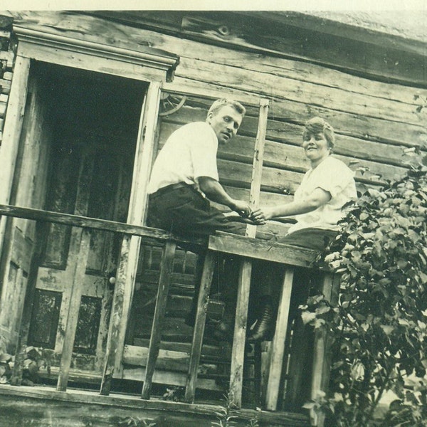 Love on The Front Porch Log Cabin Man Woman Sitting on Rail Holding Hands Button Boots Vintage Antique  Black and White Photo Photograph