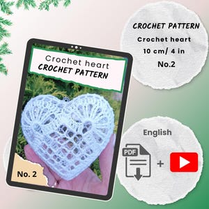 Könnte beinhalten: Ein weißes Häkelherz, etwa 10 cm groß, ist der Mittelpunkt dieses Bildes. Der Text "Crochet heart CROCHET PATTERN" wird angezeigt. Zusätzlicher Text enthält "No. 2" und "English".