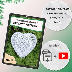 May include: A white crochet heart, approximately 4 inches in size, is displayed on a tablet screen. The image also shows the text "CROCHET PATTERN" and "Crochet heart". The pattern is No. 3 and available in English.