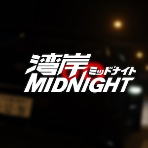 May include: A white graphic on a black background with the text "Midnight" and Japanese characters. The graphic is on the back of a car.