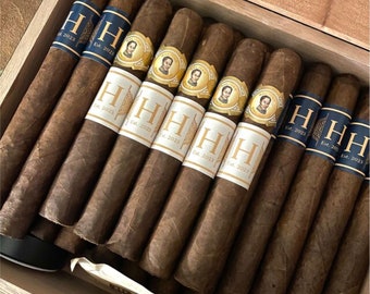 May include: A collection of ten brown cigars with gold and black labels. The labels feature the text "H Est. 2023" and a small image of a person's head.