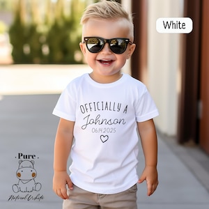 a young boy wearing sunglasses and a white shirt