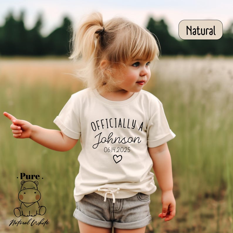 a little girl standing in a field of tall grass