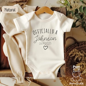 a baby's bodysuit with the name of the baby on it