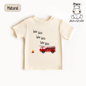 a white t - shirt with a red truck on it