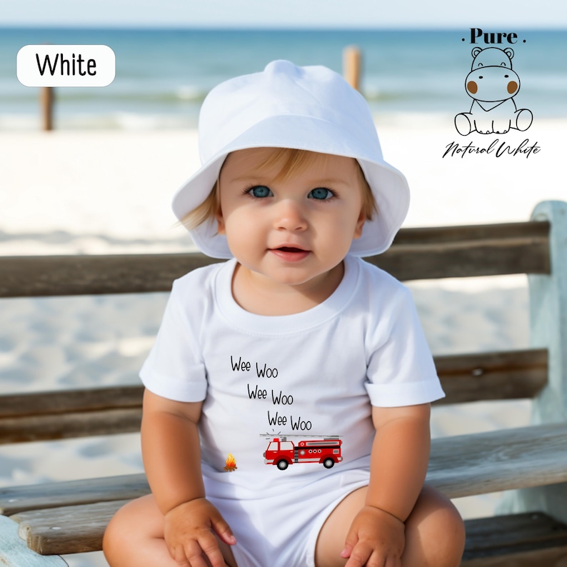 a baby sitting on a bench wearing a white hat