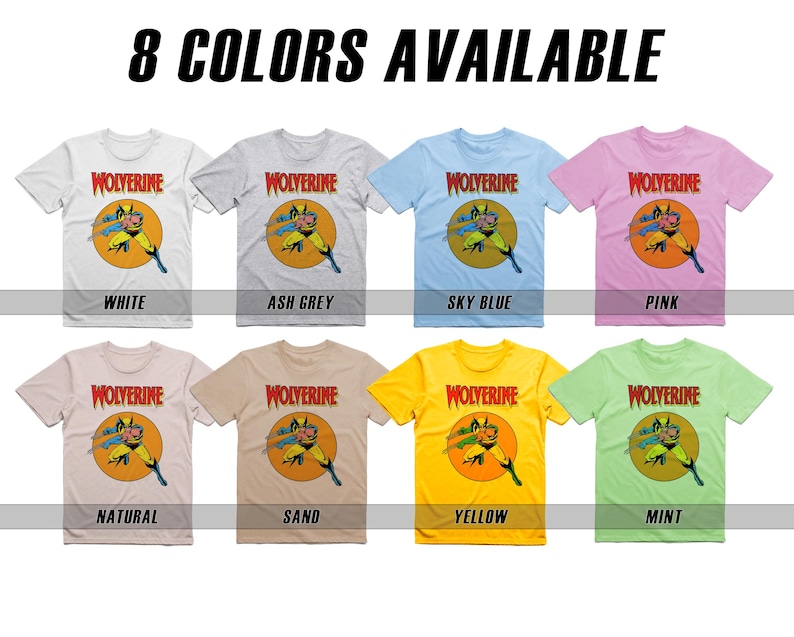May include: Eight t-shirts featuring a cartoon image of Wolverine in a yellow circle with the word "WOLVERINE" in red above the image. The t-shirts are available in the following colors: white, ash grey, sky blue, pink, natural, sand, yellow, and mint.