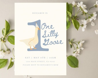 May include: A white and blue birthday invitation with a cartoon goose wearing a party hat. The invitation says "Benjamin is One Silly Goose" and includes the date, time, and address for the party.