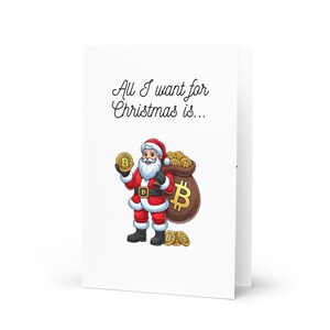 May include: A Christmas card featuring a cartoon Santa Claus holding a gold Bitcoin coin and a bag full of Bitcoin coins. The card reads "All I want for Christmas is..."
