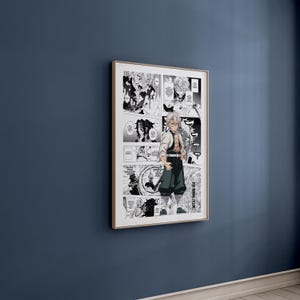 May include: A framed manga art print featuring a black and white illustration of a character from the anime series, Demon Slayer. The artwork is displayed in a gold-coloured frame and hangs on a dark blue wall.