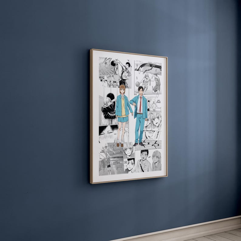 May include: A framed manga print, predominantly black and white, with a gold-coloured frame. The central image shows two figures in blue and yellow clothing holding hands. The print is mounted on a dark blue wall.