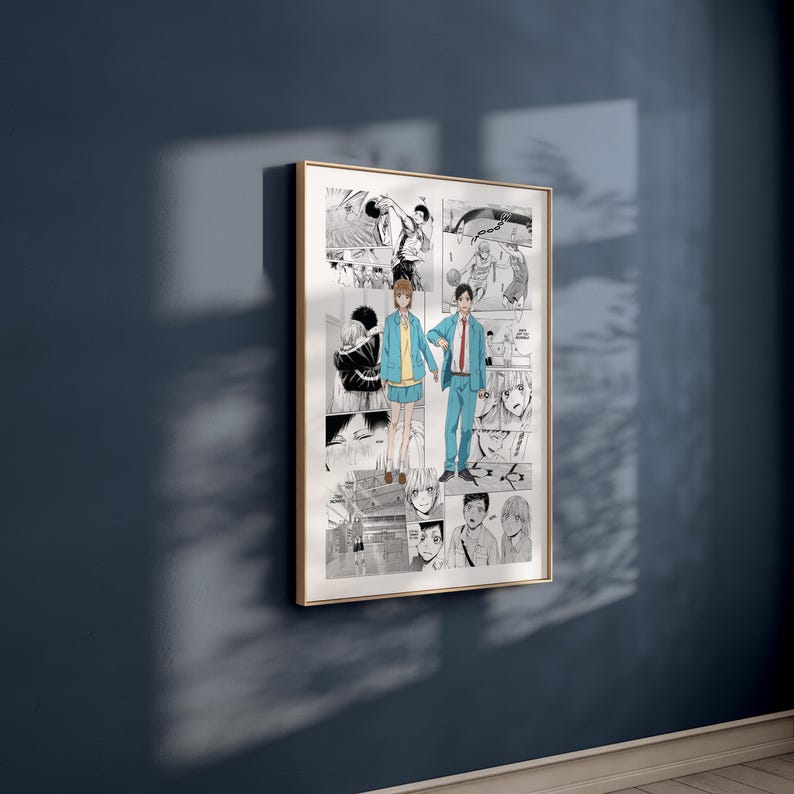 May include: A framed manga art print with a collage of black and white comic panels. The central image shows two figures in blue and yellow clothing. The artwork is displayed on a dark blue wall, with a gold-coloured frame.