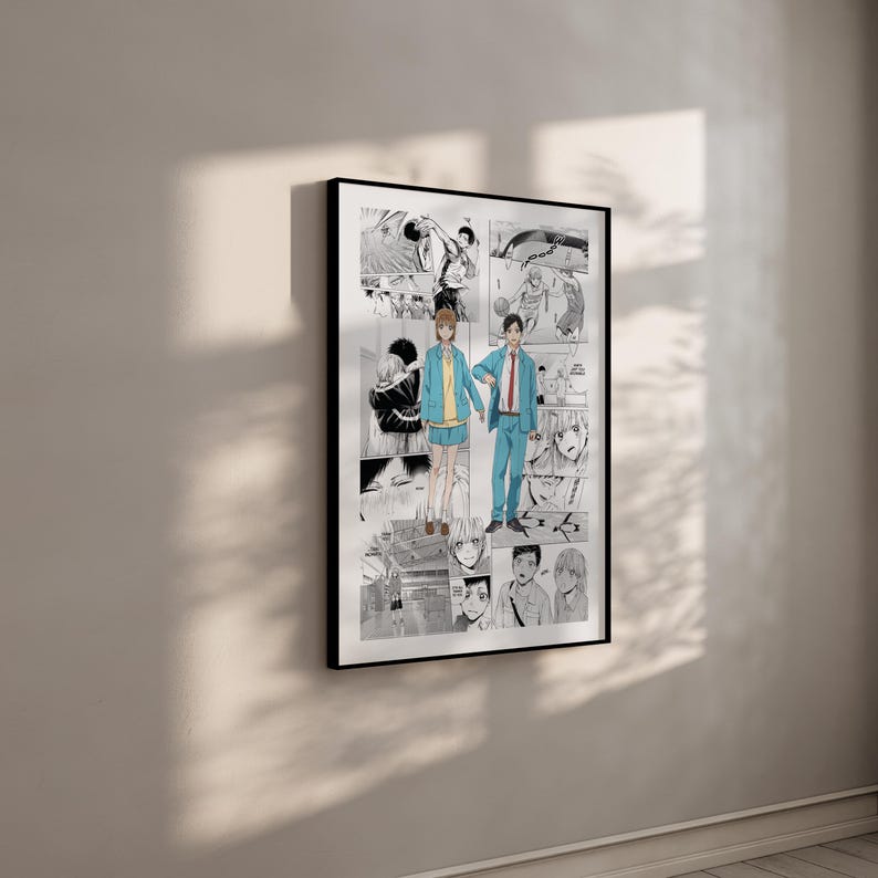 May include: A black framed print displaying a manga-style illustration. The artwork shows a couple holding hands, set against a backdrop of manga panels. The colour scheme is predominantly black, white, and grey, with accents of blue and yellow.