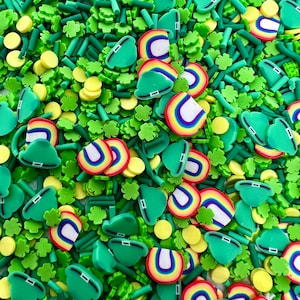 May include: A variety of green, white, and rainbow sprinkles in the shape of shamrocks, clovers, and rainbows. The sprinkles are perfect for decorating cakes, cupcakes, and other desserts.