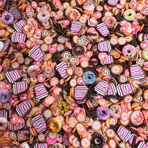 May include: A variety of colorful and detailed miniature food charms, including donuts, coffee cups, and swirls. The charms are made of polymer clay and are perfect for adding a touch of whimsy to crafts and projects.
