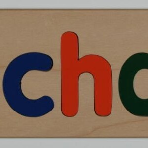 May include: Wooden puzzle with the name "Michael" spelled out in colorful letters. The letters are red, yellow, blue, orange, green, and red.