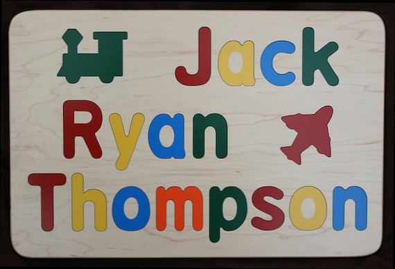 A wooden name puzzle for THREE names with raised letters — doubles as wall art and a keepsake, and 516 favorites is a serious signal that parents keep coming back for this one.