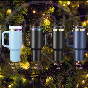 May include: Six stainless steel travel mugs with different color finishes. The mugs have a handle and a lid. The colors are pastel green, pastel blue, black, black to gold, navy to gold, and army green to gold.