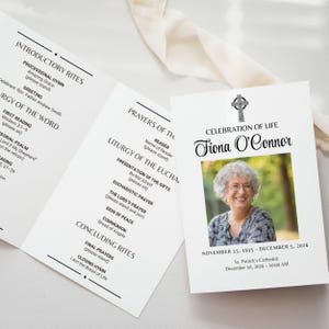 May include: A white funeral program with black text, featuring the name "Fiona O'Connor" and a photo of a woman. The program includes the order of service, date of birth, and date of passing.