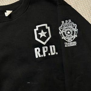 Resident Evil RPD Embroidered Sweatshirt, Raccoon City Police Hoodie, Gamer Gift for Him, Horror Game Shirt, Leon Kennedy Inspired image 3