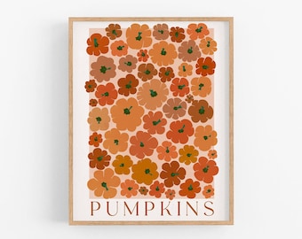 May include: A framed art print featuring a collection of stylized pumpkins in shades of orange, rust, and brown against a light peach background. The word "PUMPKINS" is printed in a serif font at the bottom. The words "DIGITAL DOWNLOAD" are printed at the bottom.