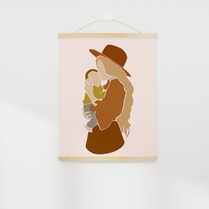 May include: Abstract art print featuring a mother and child in warm earth tones. The mother wears a rust-colored hat and dress, holding the child in a tender embrace. The artwork is displayed on a light pink background, mounted with wooden bars.
