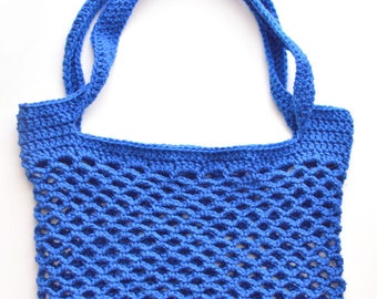 May include: A blue crocheted mesh bag with two long handles. The bag is made of a thick yarn and has a loose, open weave.