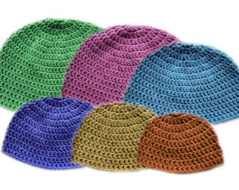 May include: Six crocheted hats in different colors: green, pink, blue, purple, brown, and beige. The hats are all the same style, with a simple, rounded shape.