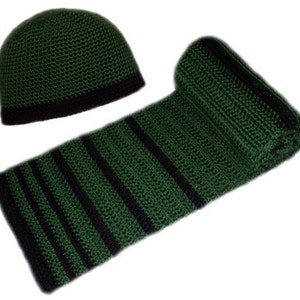 May include: A green and black crocheted hat and scarf set. The hat is a simple beanie style with a black trim. The scarf has black stripes.