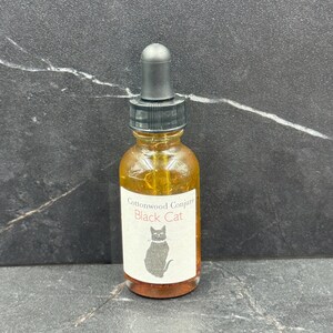Black Cat Hoodoo Oil: Reverse Bad Luck, Attract Opportunity