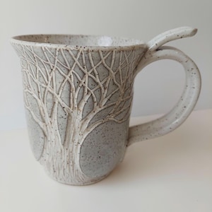 Pottery Tankard with hand carved tree
