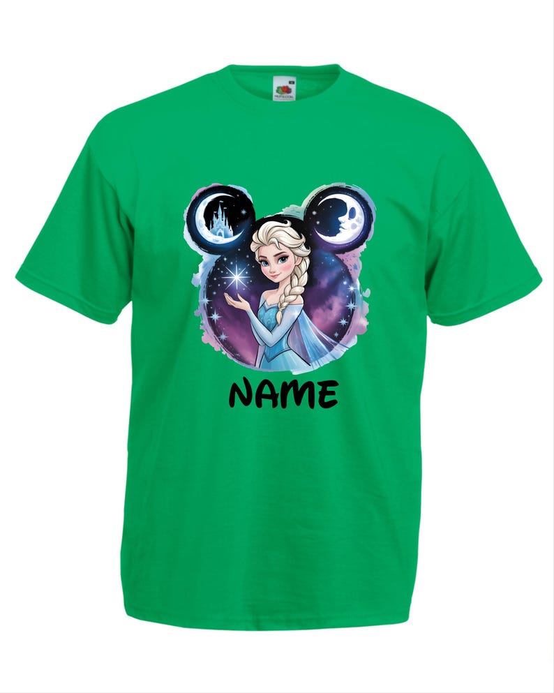 May include: A green t-shirt featuring a graphic of a princess holding a star, with a castle and moon design. The word "NAME" is printed in black below the princess image. The princess is wearing a blue dress.