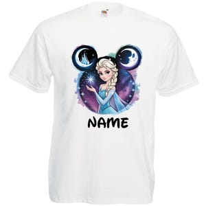 May include: White t-shirt featuring a graphic of a princess with blonde hair, wearing a blue dress, holding a star. The design includes a purple and blue galaxy background, with the word "NAME" in black font.